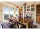 Formal dining area featuring a large table, fireplace and big windows with great views at 1426 Rembrandt Rd, Boulder, CO 80302