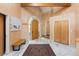 Inviting foyer with marble floors, custom woodworking, and grand arched doorway at 1426 Rembrandt Rd, Boulder, CO 80302