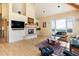 Bright living room with cozy fireplace, hardwood floors, and vaulted ceilings at 1426 Rembrandt Rd, Boulder, CO 80302
