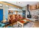 Open living room features hardwood floors, fireplace, and views of the kitchen at 1426 Rembrandt Rd, Boulder, CO 80302