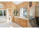 Bright main bathroom features a double vanity, soaking tub, and separate shower at 1426 Rembrandt Rd, Boulder, CO 80302
