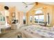 Spacious main bedroom with fireplace, vaulted ceiling, and access to the deck at 1426 Rembrandt Rd, Boulder, CO 80302