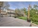 Home's backyard patio area with wooden planter boxes and lush greenery at 12036 Monaco Dr, Brighton, CO 80602