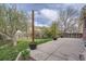 Large backyard with patio and greenery, perfect for entertaining at 12036 Monaco Dr, Brighton, CO 80602