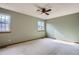 Bedroom with natural light from two large windows and neutral carpet at 12036 Monaco Dr, Brighton, CO 80602