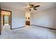 Bedroom with ceiling fan and access to the bathroom at 12036 Monaco Dr, Brighton, CO 80602