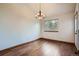 Dining area featuring hardwood floors, and a window providing natural light at 12036 Monaco Dr, Brighton, CO 80602