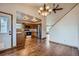 Eat-in kitchen featuring wooden cabinets, stainless steel appliances and hardwood floors at 12036 Monaco Dr, Brighton, CO 80602