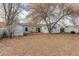 Backyard with deck, shed and mature trees at 3052 S Grape Way, Denver, CO 80222