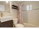 Bathroom with shower/tub combo and updated vanity at 3052 S Grape Way, Denver, CO 80222