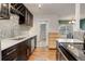 Updated kitchen with mosaic backsplash and stainless steel appliances at 3052 S Grape Way, Denver, CO 80222
