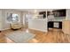 Living room with hardwood floors and kitchen views at 3052 S Grape Way, Denver, CO 80222