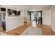 Open concept living and kitchen area with hardwood floors at 3052 S Grape Way, Denver, CO 80222