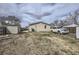 Backyard featuring a shed, vehicle parking, and a spacious area for outdoor activities at 130 Elm St, Hudson, CO 80642