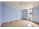 Bedroom with one window and wood floors at 130 Elm St, Hudson, CO 80642