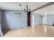View of the dining room with neutral paint, light wood flooring, and decorative lighting at 130 Elm St, Hudson, CO 80642