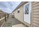 Exterior view of house with siding, a back door and a gravel perimeter at 130 Elm St, Hudson, CO 80642