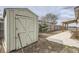 View of backyard shed, partial lawn, and covered patio at 130 Elm St, Hudson, CO 80642