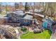 Aerial view of the backyard with a firepit, pond, patio and deck at 1325 S Ivy Way, Denver, CO 80224
