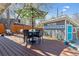 Outdoor deck featuring dining set, lounge seating, string lights and backyard views at 1325 S Ivy Way, Denver, CO 80224