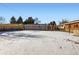 Large backyard with snow covered ground at 1040 Hoover Ave, Fort Lupton, CO 80621