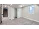 Finished basement with neutral carpet and ample space at 1040 Hoover Ave, Fort Lupton, CO 80621