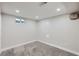 Finished basement room with neutral carpet and recessed lighting at 1040 Hoover Ave, Fort Lupton, CO 80621