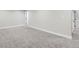 Spacious carpeted bedroom with neutral walls and ample closet space at 1040 Hoover Ave, Fort Lupton, CO 80621