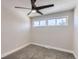 Simple bedroom with ceiling fan and neutral wall paint at 1040 Hoover Ave, Fort Lupton, CO 80621