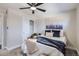 Spacious bedroom with ceiling fan and sliding door to closet at 1040 Hoover Ave, Fort Lupton, CO 80621