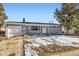 Ranch style home features a gray exterior and attached garage at 1040 Hoover Ave, Fort Lupton, CO 80621