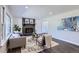 Living room boasts a fireplace, large windows, and a stylish rug at 1040 Hoover Ave, Fort Lupton, CO 80621