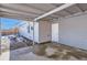 Side yard with concrete patio and access to the home at 1040 Hoover Ave, Fort Lupton, CO 80621