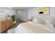 Serene bedroom featuring soft lighting, a comfortable bed, and minimalist decor at 860 Magnolia St, Denver, CO 80220