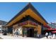 Modern building featuring floor-to-ceiling windows, wood paneling, and outdoor seating at 860 Magnolia St, Denver, CO 80220