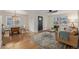 Cozy open-concept living room and dining area with hardwood floors and ample natural light at 860 Magnolia St, Denver, CO 80220