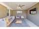 Inviting outdoor patio with comfortable seating, a ceiling fan, and a mounted television at 860 Magnolia St, Denver, CO 80220