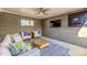Inviting outdoor patio with comfortable seating, a ceiling fan, and a mounted television at 860 Magnolia St, Denver, CO 80220