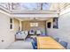 Spacious covered patio with brick walls and comfortable seating, perfect for outdoor entertaining at 860 Magnolia St, Denver, CO 80220