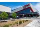 Exterior view of an AMC Dolby Cinema theater with modern architectural design, landscaping, and ample parking at 860 Magnolia St, Denver, CO 80220