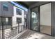 Balcony with modern railings overlooking the exterior of the townhome at 2032 S Holly St # 3, Denver, CO 80222