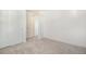 Neutral bedroom featuring plush carpet, base trim and paneled doors at 2032 S Holly St # 3, Denver, CO 80222