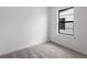 Bright bedroom featuring modern window with neutral carpet at 2032 S Holly St # 3, Denver, CO 80222
