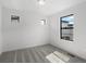 Bright bedroom featuring neutral walls, carpet, modern windows and natural light at 2032 S Holly St # 3, Denver, CO 80222