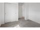 Carpeted bedroom with doors to the hallway and closet creating a clean and functional space at 2032 S Holly St # 3, Denver, CO 80222