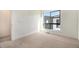 Bright bedroom features plush carpet, neutral walls and natural light from the window at 2032 S Holly St # 3, Denver, CO 80222