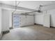 Spacious two-car garage with a door to the house and windows for natural light at 2032 S Holly St # 3, Denver, CO 80222