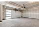 Spacious two-car garage with modern door and smooth concrete floor at 2032 S Holly St # 3, Denver, CO 80222
