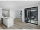Open-concept kitchen with a quartz island and large windows, perfect for entertaining at 2032 S Holly St # 3, Denver, CO 80222