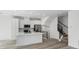Modern kitchen featuring white cabinets, quartz countertops, and stainless steel appliances at 2032 S Holly St # 3, Denver, CO 80222
